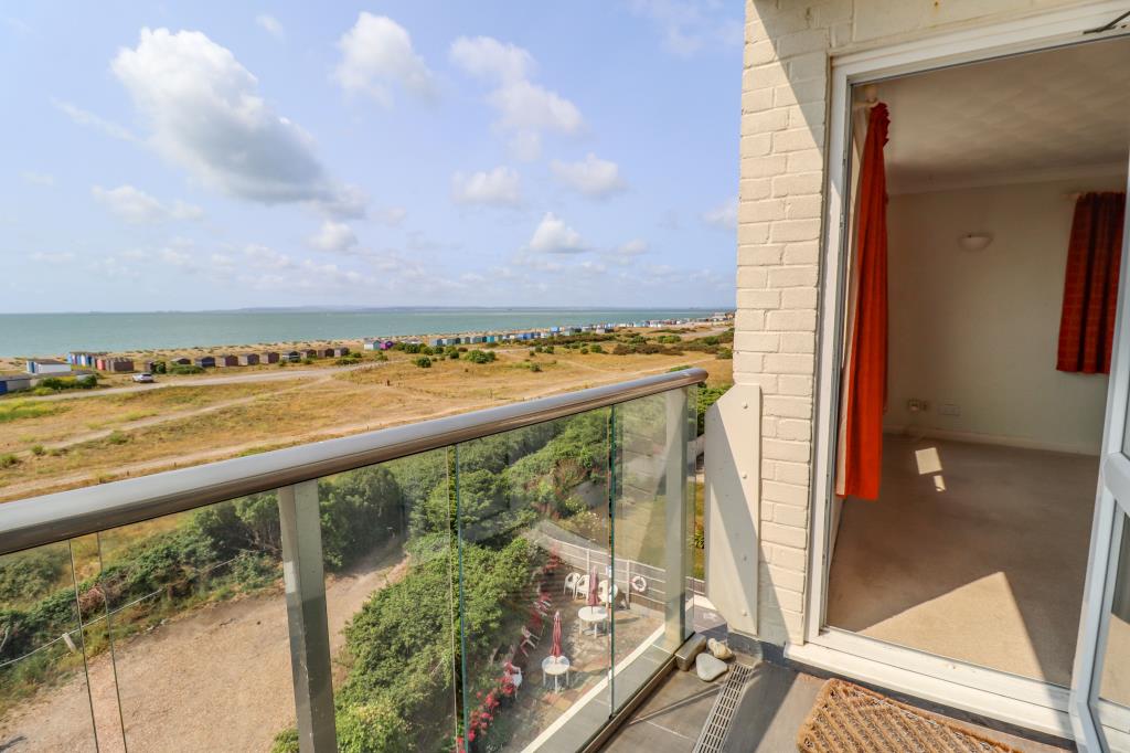 Lot: 126 - TWO-BEDROOM TOP FLOOR FLAT WITH UNINTERRUPTED SEA VIEWS - View from the balcony looking over the beach